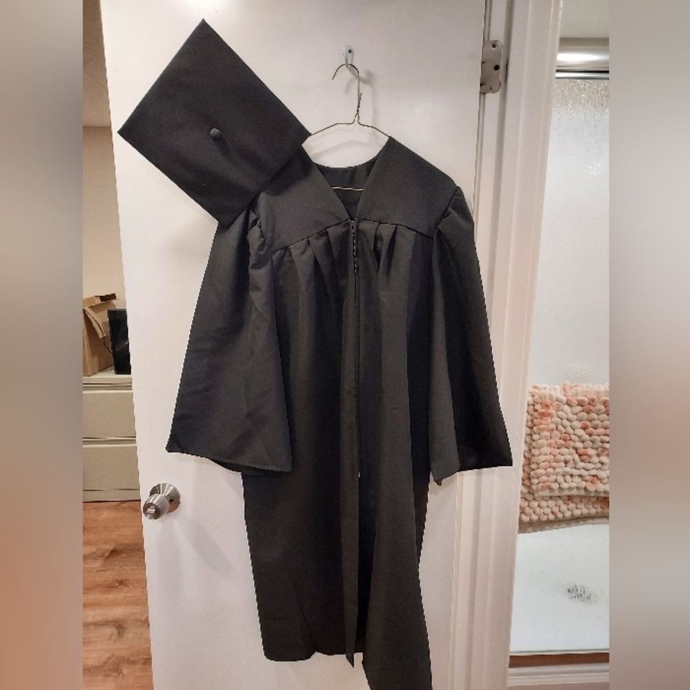 Black graduation gown and cap